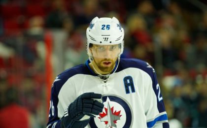 Feb 16, 2016; Raleigh, NC, USA; Winnipeg Jets forward Blake Wheeler (26) gets ready for a face off against the Carolina Hurricanes at PNC Arena. The Carolina Hurricanes defeated the Winnipeg Jets 2-1. Mandatory Credit: James Guillory-USA TODAY Sports