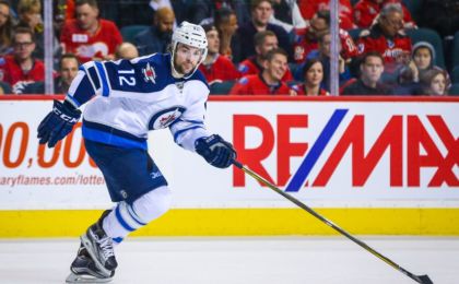 Mar 16, 2016; Calgary, Alberta, CAN; Winnipeg Jets right wing Drew Stafford (12) skates against the Calgary Flames during the first period at Scotiabank Saddledome. Calgary Flames won 4-1. Mandatory Credit: Sergei Belski-USA TODAY Sports