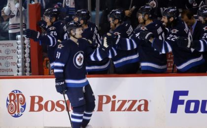 Oct 27, 2016; Winnipeg, Manitoba, CAN; Winnipeg Jet forward Kyle Connor (81) celebrates his first NHL goal with teammates during the first period against Dallas Stars at MTS Centre. Mandatory Credit: Bruce Fedyck-USA TODAY Sports