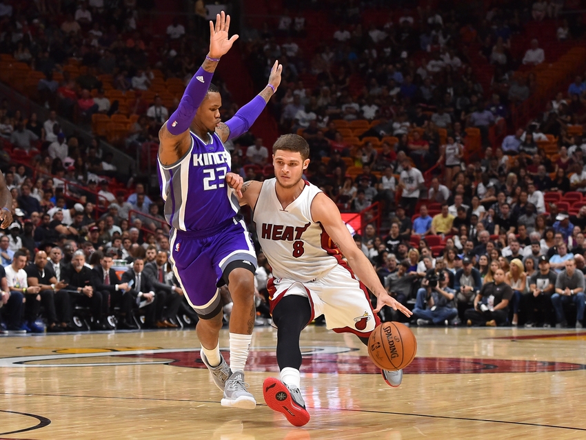 Nov 1, 2016; Miami, FL, USA; Miami Heat guard Tyler Johnson (8) dribbles the ball around Sacramento Kings guard Ben McLemore (23) during the second half at American Airlines Arena. The Miami Heat defeat the Sacramento Kings 108-96 in overtime. Mandatory Credit: Jasen Vinlove-USA TODAY Sports