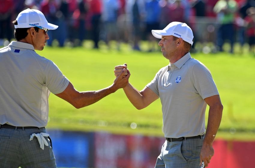 Oct 1, 2016; Chaska, MN, USA; Rafa Cabrera Bello of Spain and Sergio Garcia of Spain celebrate on the 15th hole during the morning foursome matches in the 41st Ryder Cup at Hazeltine National Golf Club. Mandatory Credit: Michael Madrid-USA TODAY Sports
