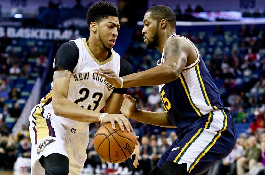Feb 10, 2016; New Orleans, LA, USA; New Orleans Pelicans forward Anthony Davis (23) drives past Utah Jazz forward Derrick Favors (15) during the first quarter of a game at the Smoothie King Center. Mandatory Credit: Derick E. Hingle-USA TODAY Sports