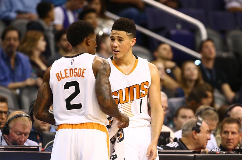Nov 27, 2016; Phoenix, AZ, USA; Phoenix Suns guard Devin Booker (right) and teammate Eric Bledsoe talk in the second half against the Denver Nuggets at Talking Stick Resort Arena. The Nuggets defeated the Suns 118-114. Mandatory Credit: Mark J. Rebilas-USA TODAY Sports