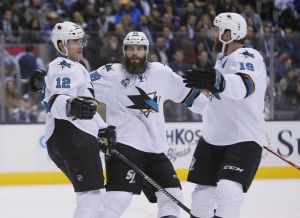 Dec 17, 2015; Toronto, Ontario, CAN; San Jose Sharks defenceman Brent Burns (88) and forward Joe Thornton (19) celebrate a goal by forward Patrick Marleau (12) during the first period against the Toronto Maple Leafs at the Air Canada Centre. Mandatory Credit: John E. Sokolowski-USA TODAY Sports