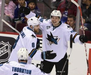 Feb 28, 2016; Vancouver, British Columbia, CAN; San Jose Sharks forward Tomas Hertl (48) celebrates his goal against Vancouver Canucks goaltender Ryan Miller (not pictured) with forward Joe Pavelski (8) and forward Joe Thornton (19) during the third period at Rogers Arena. The San Jose Sharks won 4-1. Mandatory Credit: Anne-Marie Sorvin-USA TODAY Sports