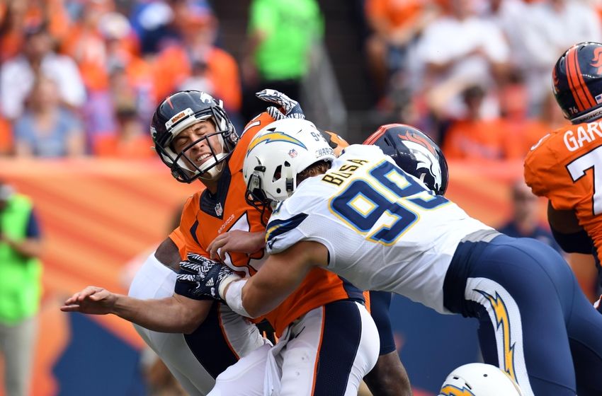 Oct 30, 2016; Denver, CO, USA; San Diego Chargers defensive end Joey Bosa (99) hits Denver Broncos quarterback Trevor Siemian (13) after a pass in the first half at Sports Authority Field at Mile High. Mandatory Credit: Ron Chenoy-USA TODAY Sports