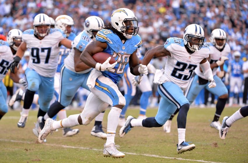 Nov 6, 2016; San Diego, CA, USA; San Diego Chargers running back Melvin Gordon (28) runs the ball as Tennessee Titans defensive back Brice McCain (23) defends during the second half at Qualcomm Stadium. San Diego won 43-35. Mandatory Credit: Orlando Ramirez-USA TODAY Sports