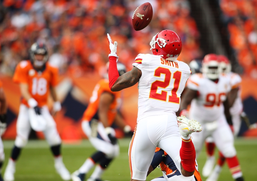 Nov 15, 2015; Denver, CO, USA; Kansas City Chiefs cornerback Sean Smith (21) intercepts a pass thrown by Denver Broncos quarterback Peyton Manning (18) during the first half at Sports Authority Field at Mile High. Mandatory Credit: Chris Humphreys-USA TODAY Sports