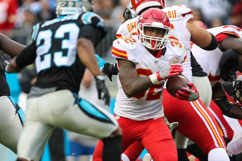 Nov 13, 2016; Charlotte, NC, USA; Kansas City Chiefs running back Spencer Ware (32) looks to elude Carolina Panthers defensive back Leonard Johnson (23) during the second half at Bank of America Stadium. The Chiefs won 20-17. Mandatory Credit: Jim Dedmon-USA TODAY Sports