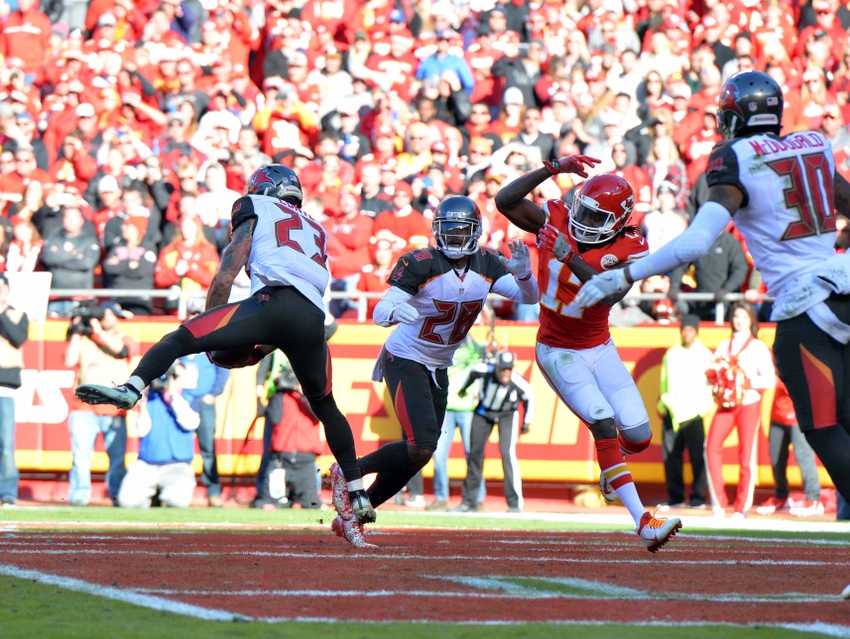 Nov 20, 2016; Kansas City, MO, USA; Tampa Bay Buccaneers strong safety Chris Conte (23) intercepts a pass intended for Kansas City Chiefs wide receiver Chris Conley (17) during the second half at Arrowhead Stadium. Tampa Bay won 19-17. Mandatory Credit: Denny Medley-USA TODAY Sports