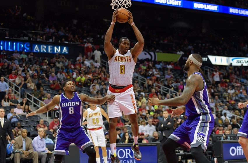 Oct 31, 2016; Atlanta, GA, USA; Atlanta Hawks center Dwight Howard (8) controls a rebound between Sacramento Kings forward Rudy Gay (8) and center DeMarcus Cousins (15) during the second half at Philips Arena. The Hawks defeated the Kings 106-95. Mandatory Credit: Dale Zanine-USA TODAY Sports