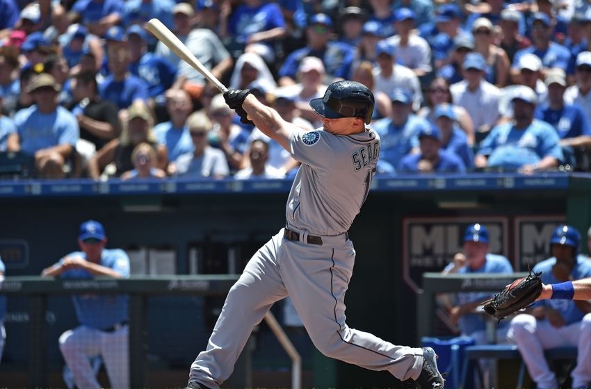 Jul 10, 2016; Kansas City, MO, USA; Seattle Mariners third basemen Kyle Seager (15) singles in two runs against the Kansas City Royals during the first inning at Kauffman Stadium. Mandatory Credit: Peter G. Aiken-USA TODAY Sports