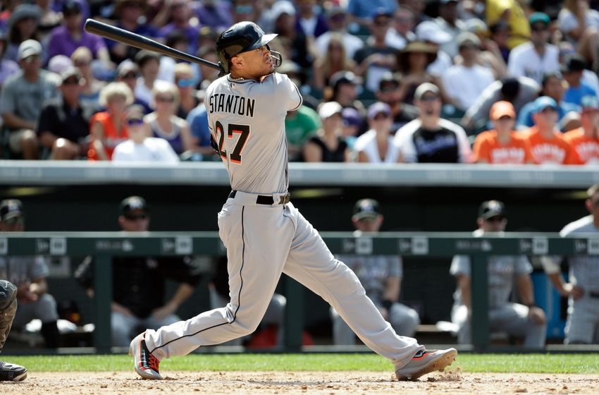 Aug 7, 2016; Denver, CO, USA; Miami Marlins right fielder Giancarlo Stanton (27) hits a two run home run in the fourth inning against the Colorado Rockies at Coors Field. Mandatory Credit: Isaiah J. Downing-USA TODAY Sports