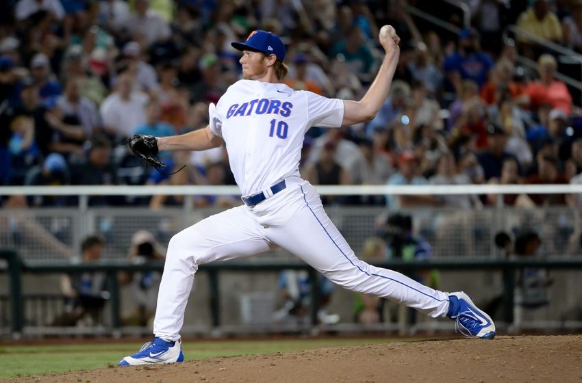 Jun 19, 2016; Omaha, NE, USA; Florida Gators pitcher A.J. Puuk (10) pitches against the Coastal Carolina Chanticleers in the eighth inning in the 2016 College World Series at TD Ameritrade Park. Coastal Carolina defeated Florida 2-1. Mandatory Credit: Steven Branscombe-USA TODAY Sports