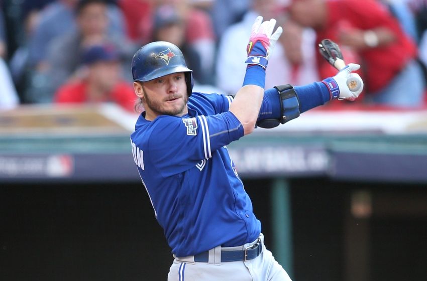 Oct 15, 2016; Cleveland, OH, USA; Toronto Blue Jays third baseman Josh Donaldson (20) hits an RBI double against the Cleveland Indians during the third inning of game two of the 2016 ALCS playoff baseball series at Progressive Field. Mandatory Credit: Charles LeClaire-USA TODAY Sports