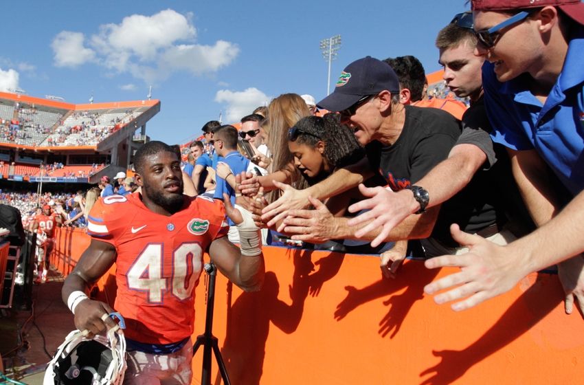 Nov 7, 2015; Gainesville, FL, USA; Florida Gators linebacker Jarrad Davis (40) high five fans as they beat the Vanderbilt Commodores at Ben Hill Griffin Stadium. Florida Gators defeated the Vanderbilt Commodores 9-7. Mandatory Credit: Kim Klement-USA TODAY Sports