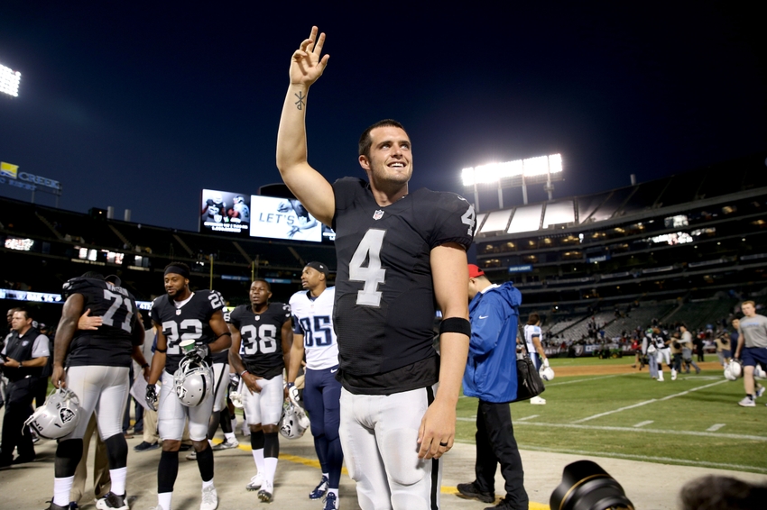 Oakland Raiders quarterback Derek Carr (4) waves towards the crowd after the game at Oakland Alameda Coliseum. The Tennessee Titans defeated the Raiders 27-14.