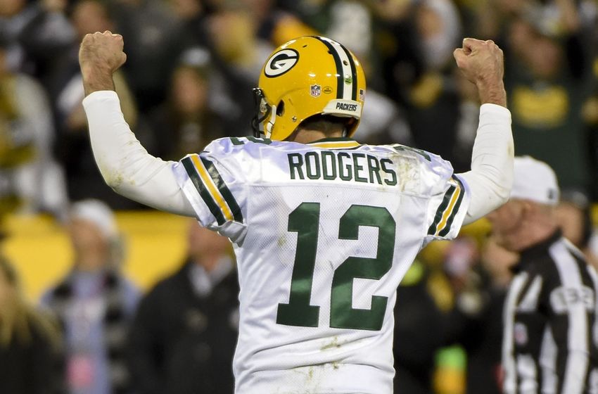 Oct 20, 2016; Green Bay, WI, USA; Green Bay Packers quarterback Aaron Rodgers (12) reacts after throwing a touchdown pass in the fourth quarter during the game against the Chicago Bears at Lambeau Field. The Packers beat the Bears 26-10. Mandatory Credit: Benny Sieu-USA TODAY Sports
