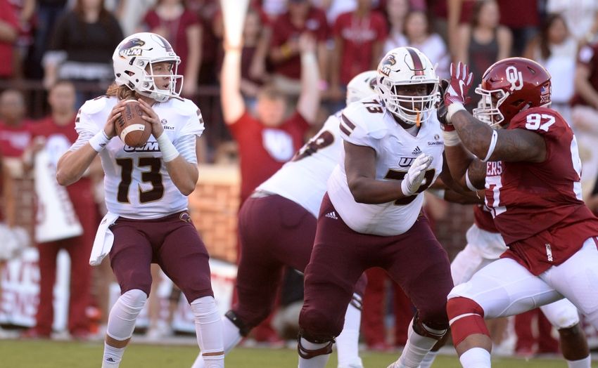 Sep 10, 2016; Norman, OK, USA; Louisiana Monroe Warhawks offensive lineman Devin Jackson Jr. (73) blocks Oklahoma Sooners defensive lineman Charles Walker (97) while Louisiana Monroe Warhawks quarterback Garrett Smith (13) looks to pass the ball during the first quarter at Gaylord Family - Oklahoma Memorial Stadium. Mandatory Credit: Mark D. Smith-USA TODAY Sports
