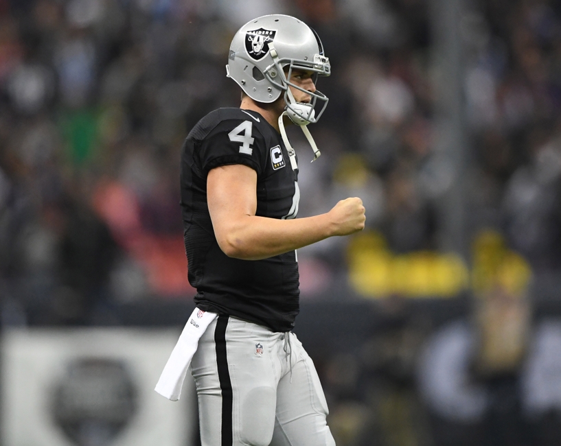 Oakland Raiders quarterback Derek Carr (4) celebrates after a touchdown in the fourth quarter against the Houston Texans during a NFL International Series game at Estadio Azteca. The Raiders defeated the Texans 27-20.