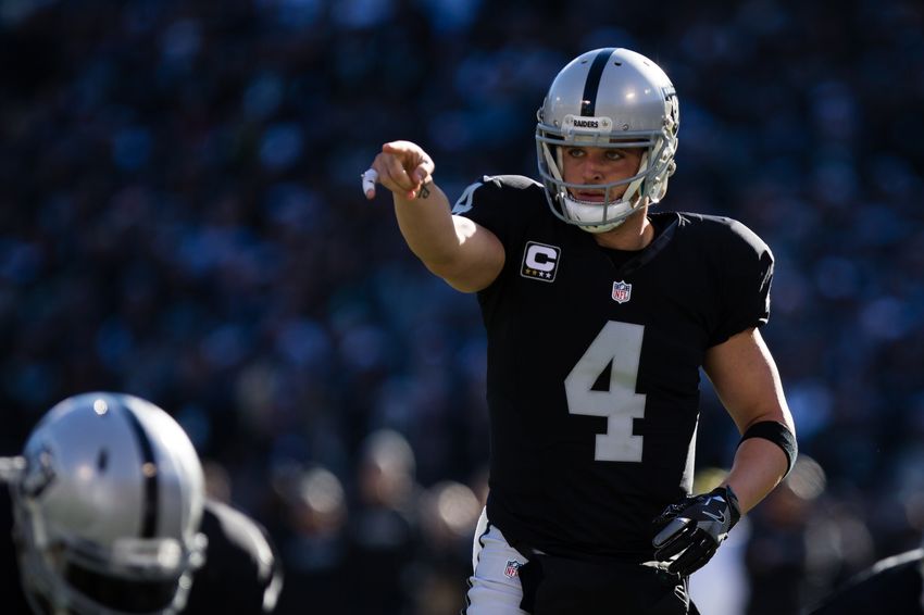 Dec 24, 2016; Oakland, CA, USA; Oakland Raiders quarterback Derek Carr (4) gestures before the snap against the Indianapolis Colts during the first quarter at the Oakland Coliseum. Mandatory Credit: Kelley L Cox-USA TODAY Sports