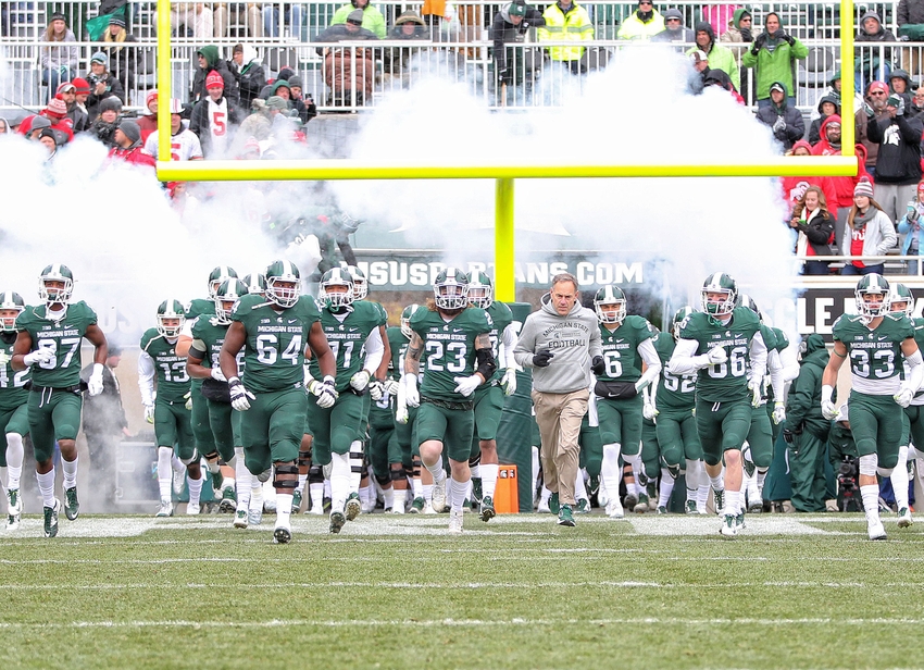 Nov 19, 2016; East Lansing, MI, USA; Michigan State Spartans head coach Mark Dantonio leads his team onto the field prior to the game against the Ohio State Buckeyes at Spartan Stadium. Mandatory Credit: Mike Carter-USA TODAY Sports
