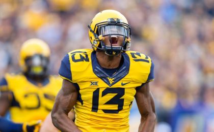 Oct 1, 2016; Morgantown, WV, USA; West Virginia Mountaineers cornerback Rasul Douglas (13) reacts after making a tackle during the first quarter against the Kansas State Wildcats at Milan Puskar Stadium. Mandatory Credit: Ben Queen-USA TODAY Sports