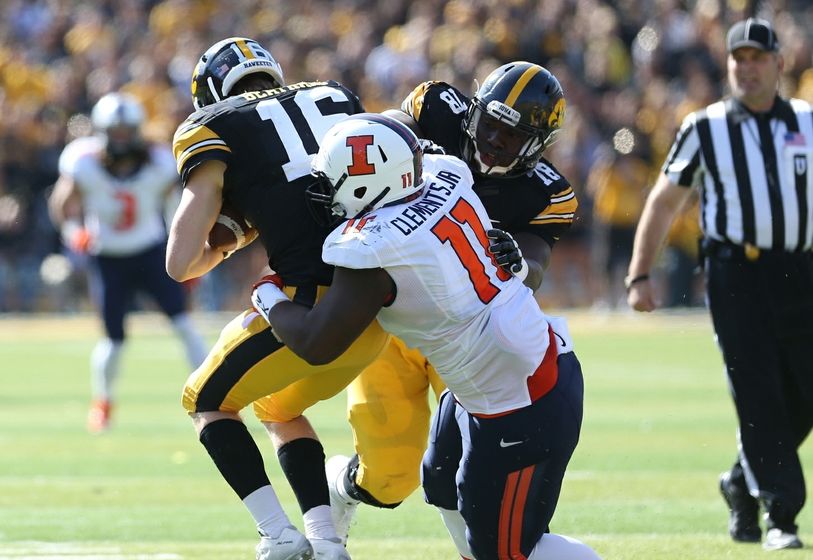 Oct 10, 2015; Iowa City, IA, USA; Fighting Illini defensive lineman Chunky Clements (11) sacks Iowa Hawkeyes quarterback C.J. Beathard (16) at Kinnick Stadium. Mandatory Credit: Reese Strickland-USA TODAY Sports