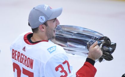 Sep 29, 2016; Toronto, Ontario, Canada; Team Canada center Patrice Bergeron (37) hoists the World Cup of Hockey championship trophy after game two of the World Cup of Hockey final against Team Europe at Air Canada Centre. Mandatory Credit: Dan Hamilton-USA TODAY Sports