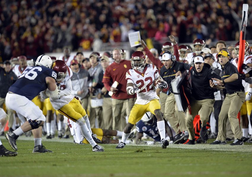 January 2, 2017; Pasadena, CA, USA; Southern California Trojans defensive back Leon McQuay III (22) runs the ball after an interception as linebacker Quinton Powell (18) provides a block against Penn State Nittany Lions offensive lineman Connor McGovern (66) during the second half of the 2017 Rose Bowl game at the Rose Bowl. Mandatory Credit: Gary A. Vasquez-USA TODAY Sports