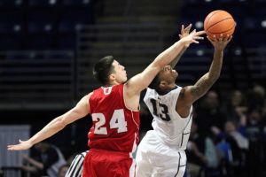 Feb 18, 2015; University Park, PA, USA; Wisconsin Badgers guard Bronson Koenig (24) defends as Penn State Nittany Lions guard Geno Thorpe (13) drives to the basket during the second half at Bryce Jordan Center. Wisconsin defeated Penn State 55-47. Mandatory Credit: Matthew O