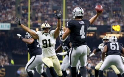 Sep 11, 2016; New Orleans, LA, USA; New Orleans Saints defensive end Kasim Edebali (91) pressures Oakland Raiders quarterback Derek Carr (4) in the first quarter at the Mercedes-Benz Superdome. Mandatory Credit: Chuck Cook-USA TODAY Sports