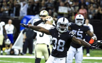 Sep 11, 2016; New Orleans, LA, USA; Oakland Raiders strong safety T.J. Carrie (38) celebrates after New Orleans Saints kicker Will Lutz (3) misses a 61 yard field goal attempt as time expires during the fourth quarter of a game at the Mercedes-Benz Superdome. The Raiders defeated the Saints 35-34. Mandatory Credit: Derick E. Hingle-USA TODAY Sports