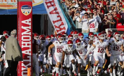 Dec 31, 2015; Miami Gardens, FL, USA; The Oklahoma Sooners run out for the start of the 2015 CFP Semifinal against the Clemson Tigers at the Orange Bowl at Sun Life Stadium. Mandatory Credit: Kim Klement-USA TODAY Sports