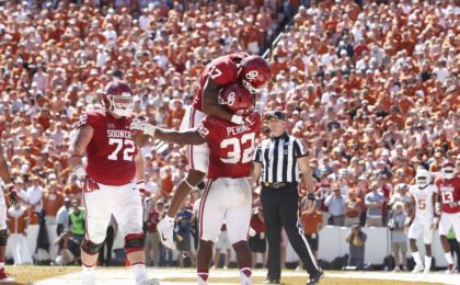 Oct 8, 2016; Dallas, TX, USA; Oklahoma Sooners running back Samaje Perine (32) and wide receiver Jordan Smallwood (17) and offensive lineman Ben Powers (72) celebrate a touchdown in the fourth quarter against the Texas Longhorns at Cotton Bowl. Oklahoma won 45-40. Mandatory Credit: Tim Heitman-USA TODAY Sports