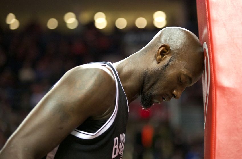 Nov 15, 2014; Portland, OR, USA; Brooklyn Nets forward Kevin Garnett (2) rests his head on the basketball stanchion before playing Portland Trail Blazers at Moda Center at the Rose Quarter. Mandatory Credit: Jaime Valdez-USA TODAY Sports