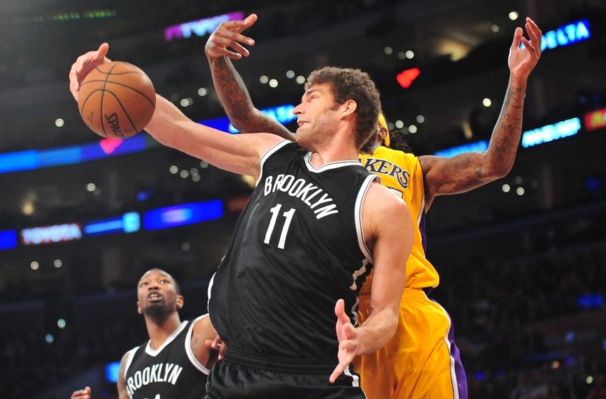 February 20, 2015; Los Angeles, CA, USA; Brooklyn Nets center Brook Lopez (11) grabs a rebound against the Los Angeles Lakers during the second half at Staples Center. Mandatory Credit: Gary A. Vasquez-USA TODAY Sports