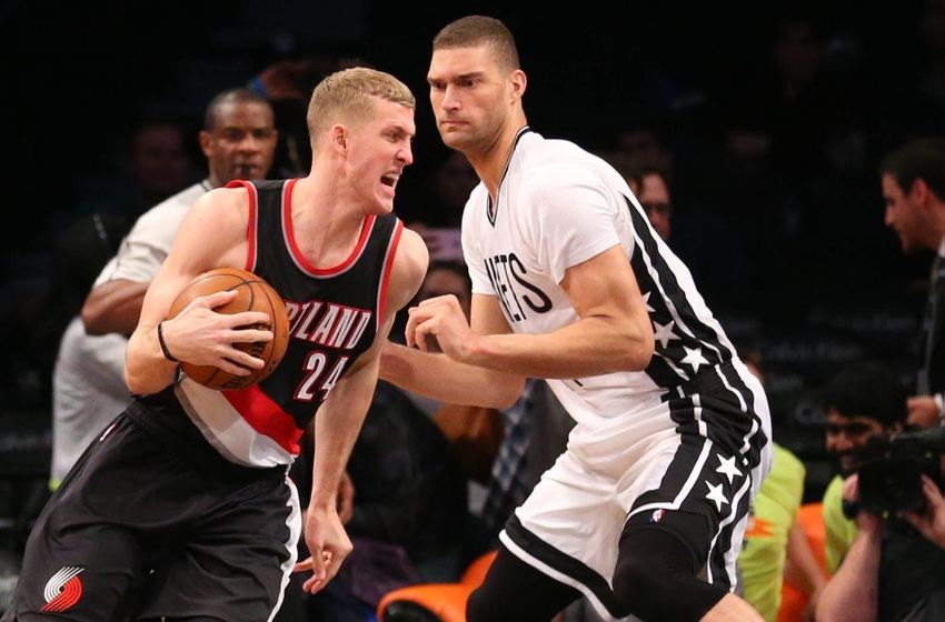 Jan 15, 2016; Brooklyn, NY, USA; Portland Trail Blazers center Mason Plumlee (24) moves against Brooklyn Nets center Brook Lopez (11) during the third quarter at Barclays Center. Portland Trail Blazers won 116-104. Mandatory Credit: Anthony Gruppuso-USA TODAY Sports