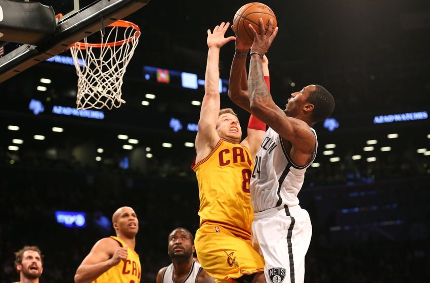Mar 24, 2016; Brooklyn, NY, USA; Brooklyn Nets guard Rondae Hollis-Jefferson (24) shoots over Cleveland Cavaliers guard Matthew Dellavedova (8) during the fourth quarter at Barclays Center. Brooklyn won 104-95. Mandatory Credit: Anthony Gruppuso-USA TODAY Sports