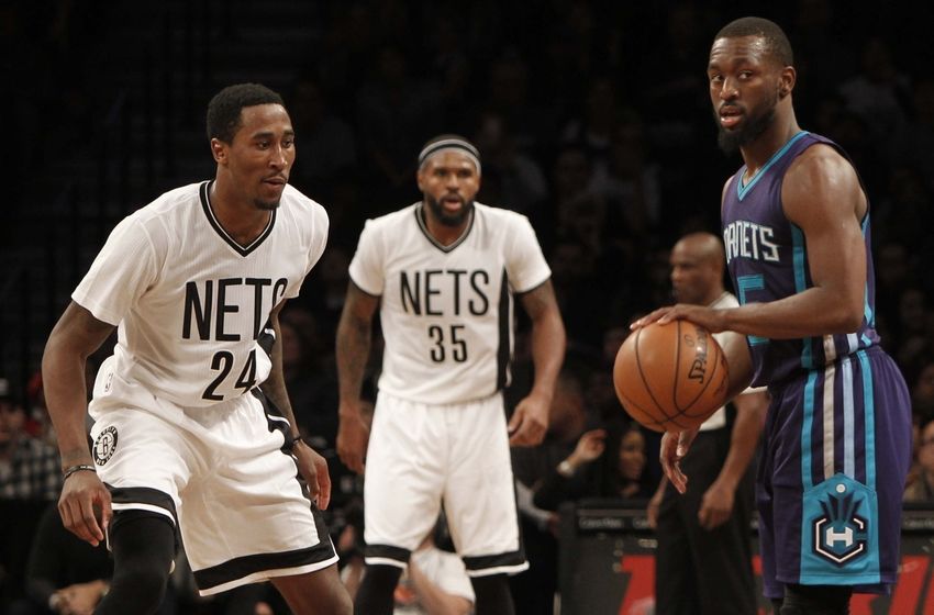 Nov 4, 2016; Brooklyn, NY, USA; Charlotte Hornets guard Kemba Walker (15) in the fourth quarter against Brooklyn Nets guard Rondae Hollis-Jefferson (24) and forward Trevor Booker (35) at Barclays Center. Hornets win 99-95. Mandatory Credit: Nicole Sweet-USA TODAY Sports