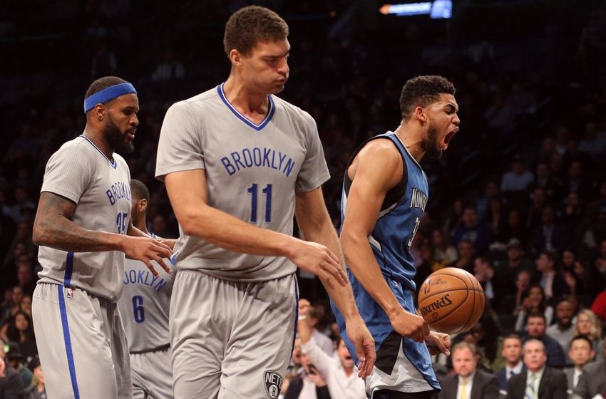 Nov 8, 2016; Brooklyn, NY, USA; Minnesota Timberwolves center Karl-Anthony Towns (32) reacts after dunking over Brooklyn Nets center Brook Lopez (11) during the second quarter at Barclays Center. Mandatory Credit: Brad Penner-USA TODAY Sports
