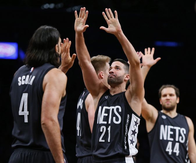 Oct 28, 2016; Brooklyn, NY, USA; Brooklyn Nets guard Greivis Vasquez (21) and forward Luis Scola (4) react after leading in the fourth quarter against the Indiana Pacers during second half at Barclays Center. The Nets won 103-94.Mandatory Credit: Noah K. Murray-USA TODAY Sports