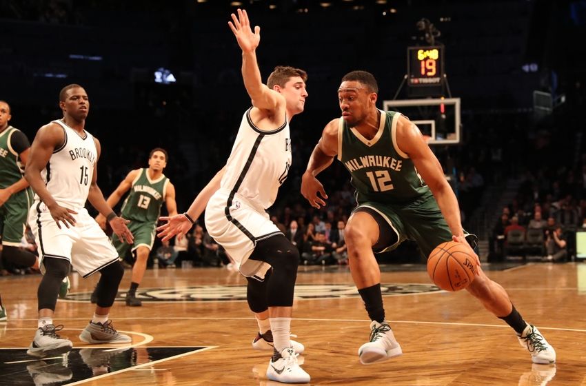 Dec 1, 2016; Brooklyn, NY, USA; Milwaukee Bucks forward Jabari Parker (12) drives past Brooklyn Nets forward Joe Harris (12) during the first quarter at Barclays Center. Mandatory Credit: Anthony Gruppuso-USA TODAY Sports