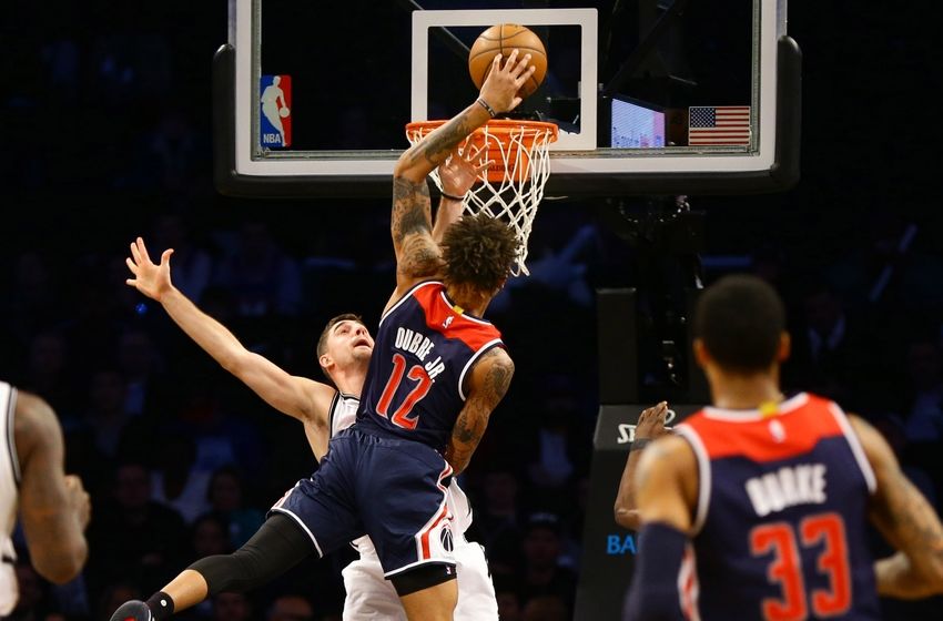 Dec 5, 2016; Brooklyn, NY, USA; Washington Wizards forward Kelly Oubre Jr. (12) goes up for a shot over Brooklyn Nets guard Jie Harris (12) during the second half at Barclays Center. The Wizards won 118-113. Mandatory Credit: Andy Marlin-USA TODAY Sports