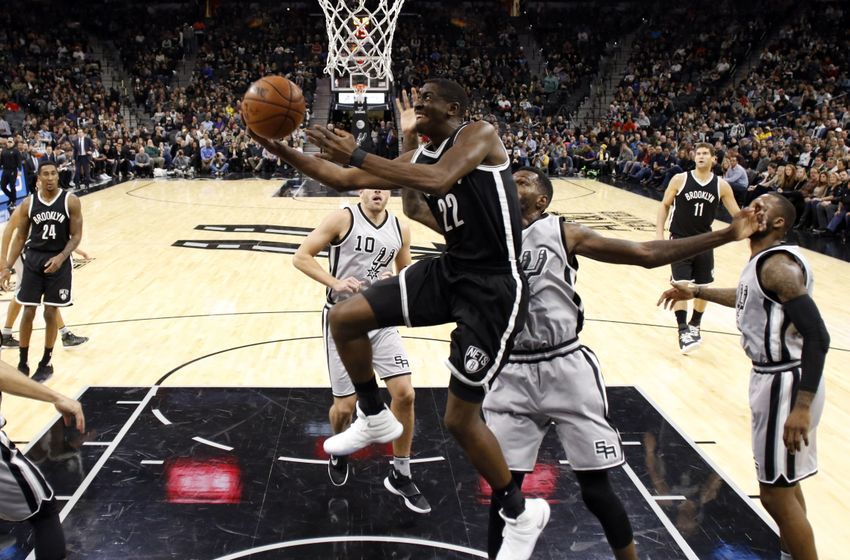 Dec 10, 2016; San Antonio, TX, USA; Brooklyn Nets shooting guard Caris LeVert (22) shoots the ball past San Antonio Spurs center Dewayne Dedmon (3, right) during the first half at AT&T Center. Mandatory Credit: Soobum Im-USA TODAY Sports