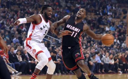 Nov 4, 2016; Toronto, Ontario, CAN; Miami Heat guard Dion Waiters (11) tries to get past Toronto Raptors forward DeMarre Carroll (5) in the first half at Air Canada Centre. Mandatory Credit: Dan Hamilton-USA TODAY Sports