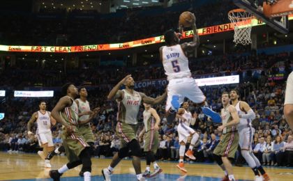 Nov 7, 2016; Oklahoma City, OK, USA; Oklahoma City Thunder guard Victor Oladipo (5) drives to the basket in front of Miami Heat forward James Johnson (16) during the third quarter at Chesapeake Energy Arena. Mandatory Credit: Mark D. Smith-USA TODAY Sports