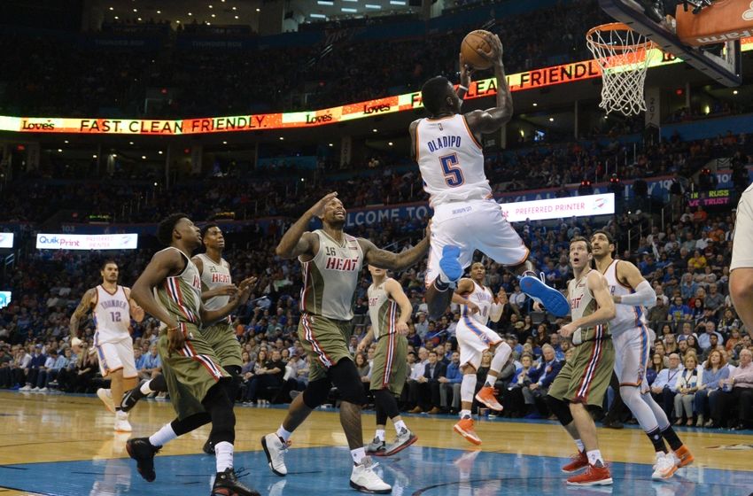 Nov 7, 2016; Oklahoma City, OK, USA; Oklahoma City Thunder guard Victor Oladipo (5) drives to the basket in front of Miami Heat forward James Johnson (16) during the third quarter at Chesapeake Energy Arena. Mandatory Credit: Mark D. Smith-USA TODAY Sports