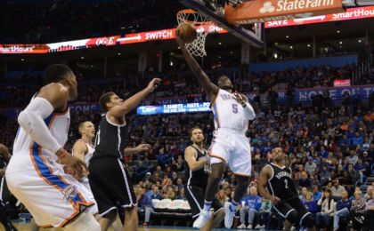 Nov 18, 2016; Oklahoma City, OK, USA; Oklahoma City Thunder guard Victor Oladipo (5) shoots the ball in front of Brooklyn Nets center Brook Lopez (11) during the third quarter at Chesapeake Energy Arena. Mandatory Credit: Mark D. Smith-USA TODAY Sports