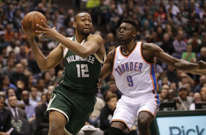 Jan 2, 2017; Milwaukee, WI, USA; Milwaukee Bucks forward Jabari Parker (12) drives for the basket around Oklahoma City Thunder forward Jerami Grant (9) during the fourth quarter at BMO Harris Bradley Center. Milwaukee won 98-94. Mandatory Credit: Jeff Hanisch-USA TODAY Sports